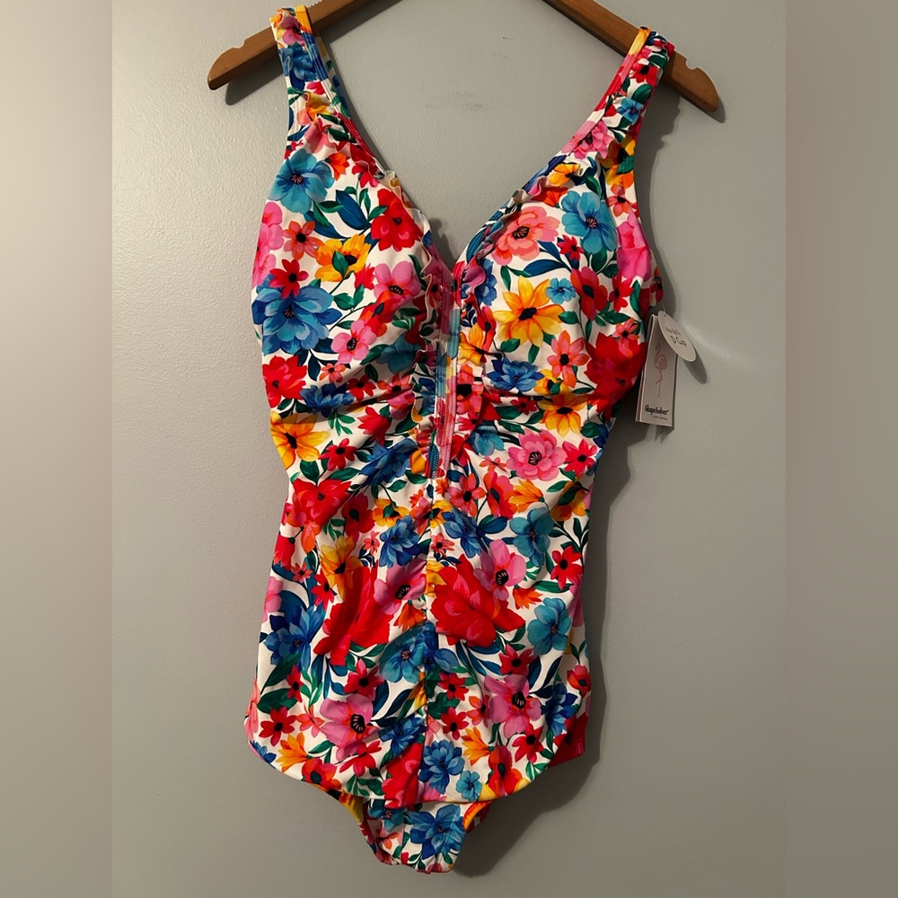 Women’s 1 piece swim suit. New with tags in size 14.